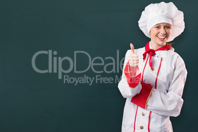 Composite image of pretty chef showing thumbs up