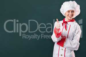 Composite image of pretty chef showing thumbs up