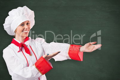 Composite image of pretty chef presenting with hands