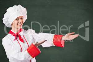 Composite image of pretty chef presenting with hands