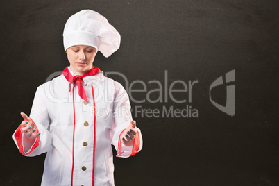 Composite image of pretty chef standing with hands out