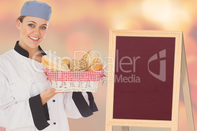 Composite image of woman in chef uniform with bread basket