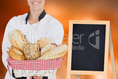 Composite image of woman holding bread bag