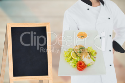 Composite image of a cook holding vegetables