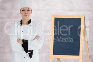 Composite image of portrait of confident female chef