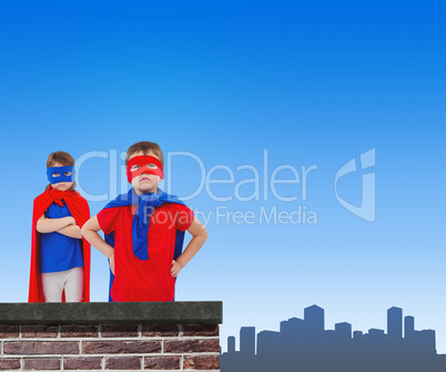 Composite image of masked kids pretending to be superheroes