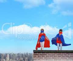 Composite image of masked kids running pretending to be superheroes