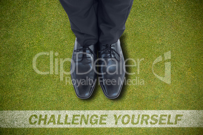 Composite image of businessmans feet in black brogues