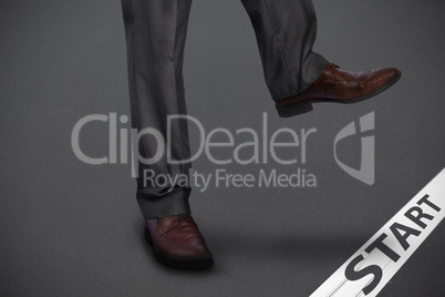 Composite image of businessman stepping