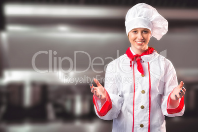 Composite image of pretty chef standing with hands out