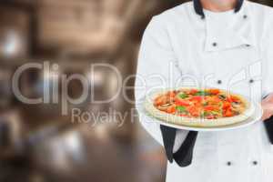 Composite image of male chef offering pizza