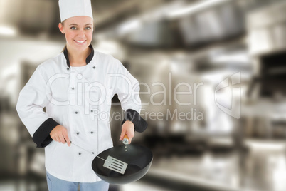 Composite image of portrait of chef using spetula and frying pan
