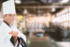 Composite image of male chef presenting an invisible product