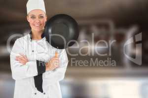 Composite image of female chef with arms crossed holds frying pan