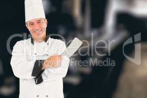Composite image of man in chef uniform holding meat cleaver