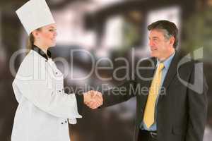 Composite image of businessman and female chef shaking hands