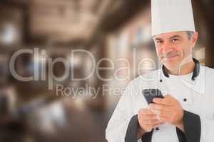 Composite image of portrait of happy chef holding cell phone