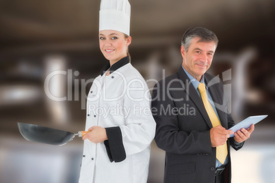 Composite image of businessman holding digital tablet and chef with frying pan