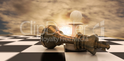Composite image of white pawn standing over fallen black king