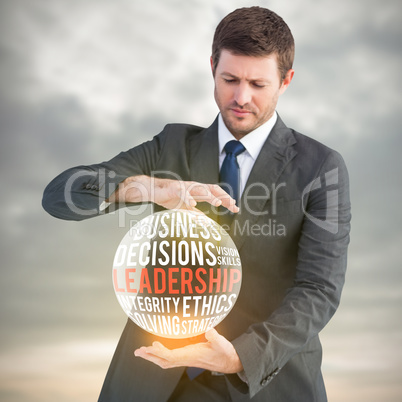 Composite image of businessman showing something with his hands