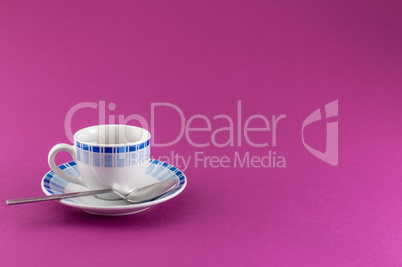 Little cup of coffee on colored background