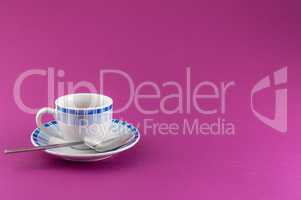 Little cup of coffee on colored background