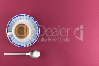 Little cup of coffee on colored background