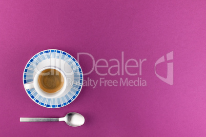 Little cup of coffee on colored background