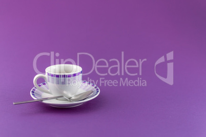 Little cup of coffee on colored background