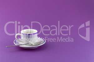 Little cup of coffee on colored background