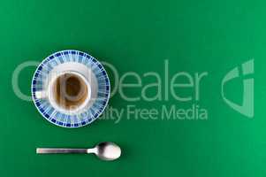 Little cup of coffee on colored background