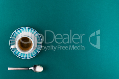 Little cup of coffee on colored background
