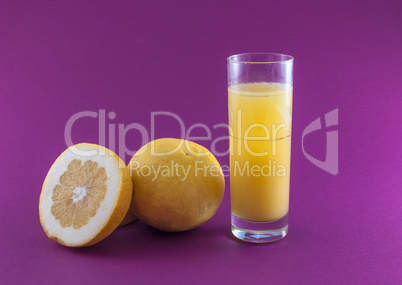 grapefruit juice on colored background