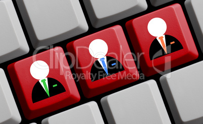 Drei Business Symbole auf Computer Tastatur