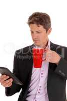Closeup of businessman with red mug.