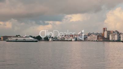 Ferry-Catamaran Sails on a Background of the City, Portugal