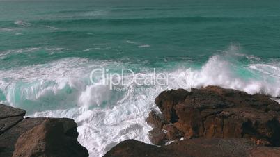Ocean Waves Breaking on Rock, sunny weather
