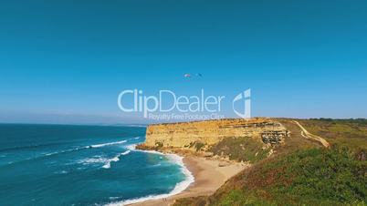 Paragliders Fly Over the Ocean Beach, sunny day