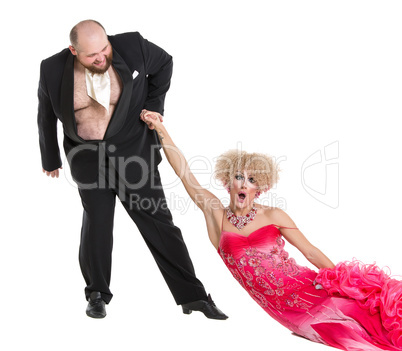 Eccentric Fat Man Dragging a Woman by the Hand Lying on Floor