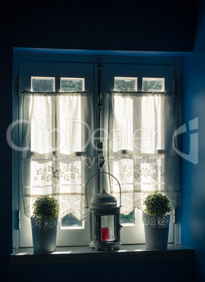 Vintage Window and Curtain with Flower Pots and Old Lamp
