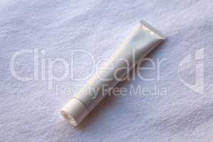 White tube of toothpaste, cream or gel
