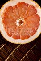 Cut half of juicy ripe grapefruit