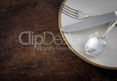 Close up Spoon, Fork and Knife Tied on White Dish with Empty Tag