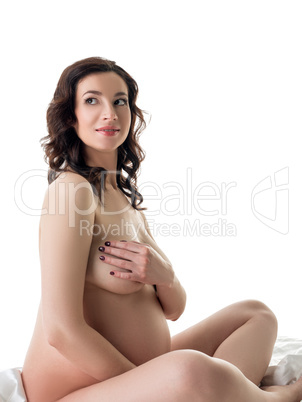 Studio photo of nice pregnant woman posing nude