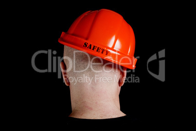 Construction worker in hard hat with an inscription safety