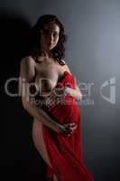 Beautiful expectant mother posing bared her breast