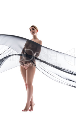 Naked woman posing and her body closes with fabric