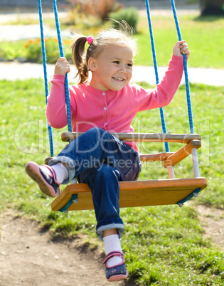 Cute little girl on swing