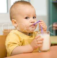 Little boy is drinking milk