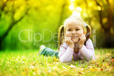Portrait of a little girl in autumn park